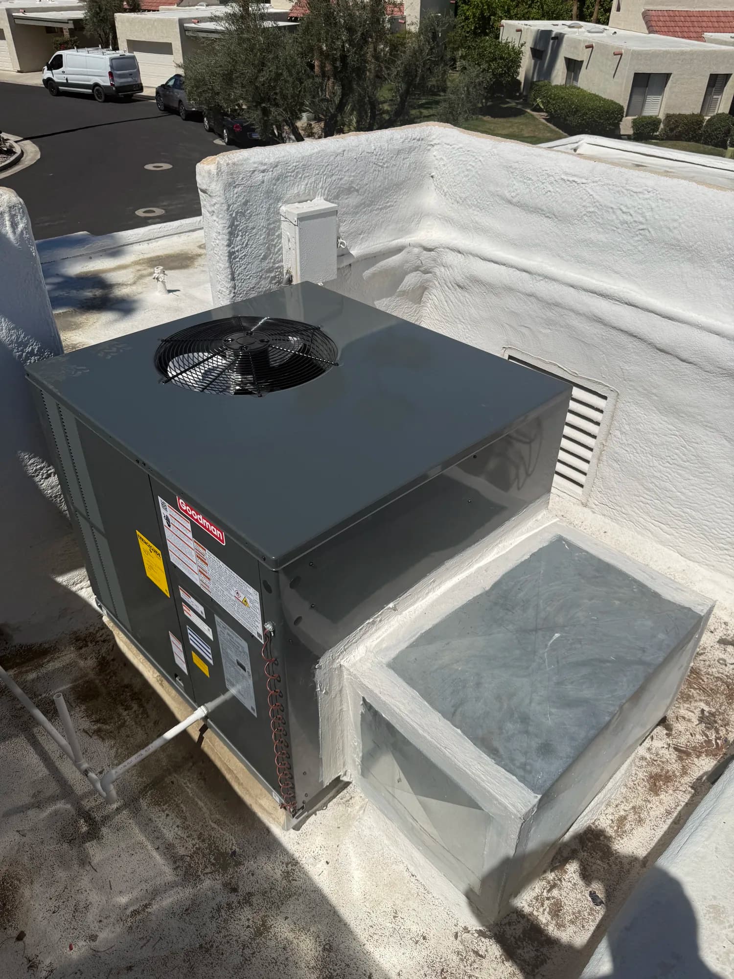 Commercial rooftop unit overlooking a courtyard property