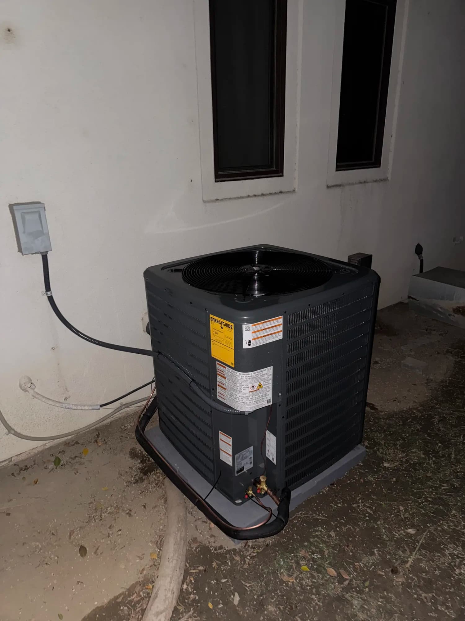 Residential outdoor condenser installation